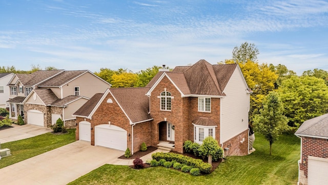 57677 Blossom Valley Trl, New Hudson, MI 48165 - view of front of property with brick siding, concrete driveway, a front yard, a garage, and a shingled roof