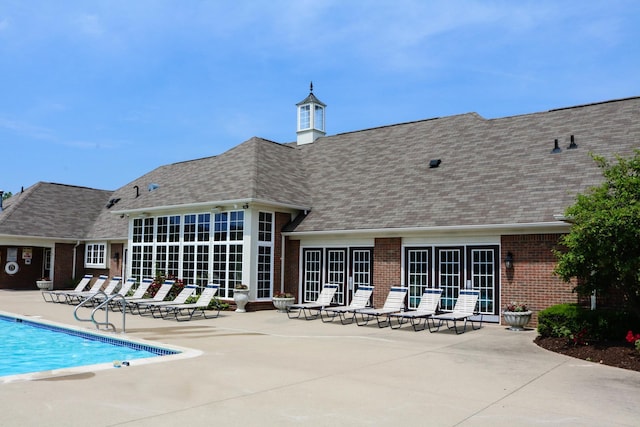 57677 Blossom Valley Trl, New Hudson, MI 48165 - community pool with a patio and french doors