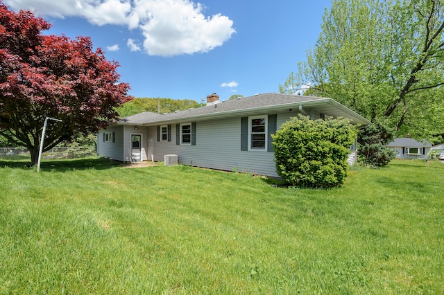 8118 Bruning St, Portage, MI 49002 - rear view of house with central AC unit and a chimney