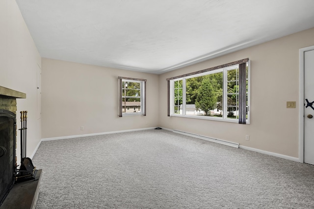 8118 Bruning St, Portage, MI 49002 - unfurnished living room with baseboard heating, carpet, a stone fireplace, and baseboards
