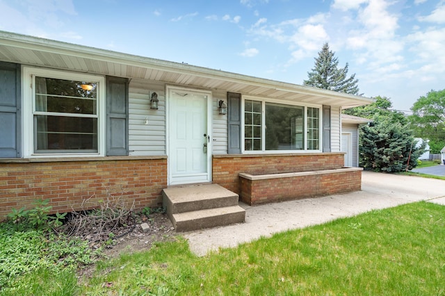 8118 Bruning St, Portage, MI 49002 - property entrance featuring brick siding