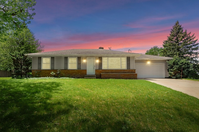 8118 Bruning St, Portage, MI 49002 - ranch-style house featuring a garage, driveway, brick siding, a lawn, and a chimney