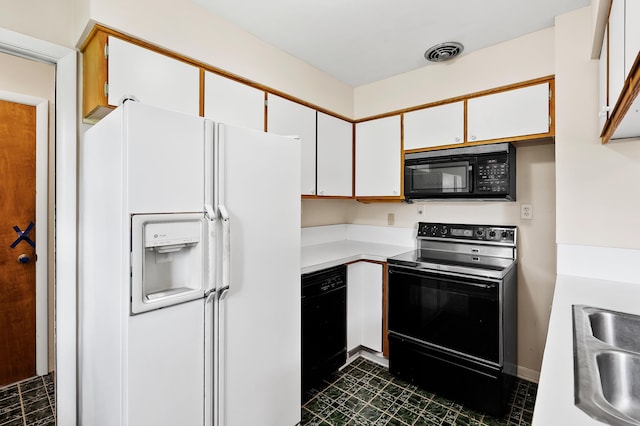 8118 Bruning St, Portage, MI 49002 - kitchen featuring black appliances, a sink, light countertops, and white cabinets