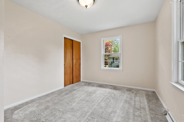 8118 Bruning St, Portage, MI 49002 - unfurnished room featuring carpet flooring, baseboard heating, and baseboards