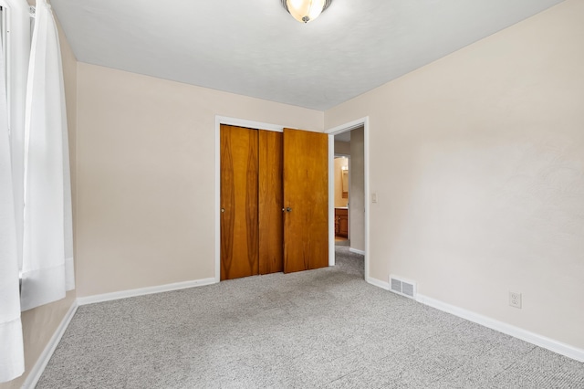 8118 Bruning St, Portage, MI 49002 - unfurnished bedroom with carpet, baseboards, and a closet