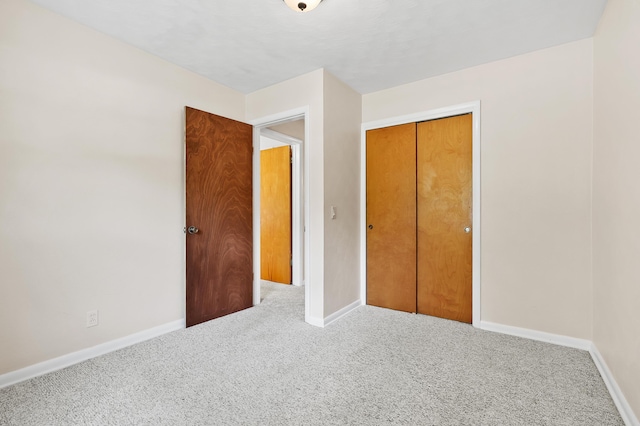 8118 Bruning St, Portage, MI 49002 - unfurnished bedroom featuring carpet floors, baseboards, and a closet