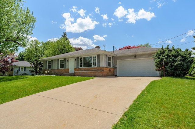 8118 Bruning St, Portage, MI 49002 - ranch-style home with brick siding, an attached garage, driveway, a front yard, and a chimney
