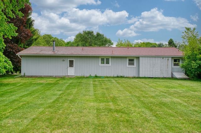 4384 Dexter Pinckney Rd, Dexter, MI 48130 - rear view of house featuring a lawn