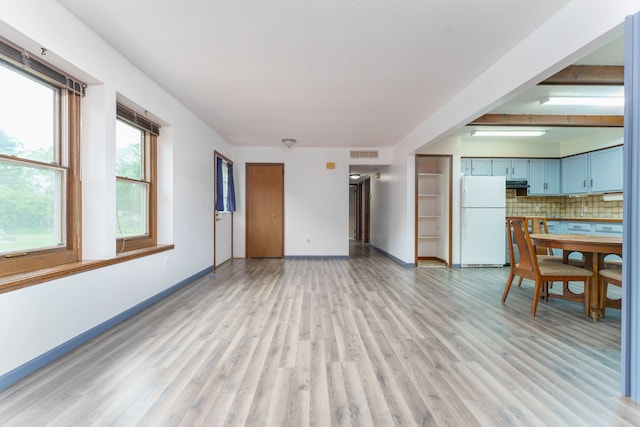 4384 Dexter Pinckney Rd, Dexter, MI 48130 - unfurnished living room featuring light wood-type flooring and baseboards