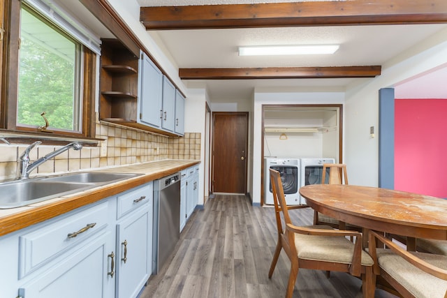 4384 Dexter Pinckney Rd, Dexter, MI 48130 - kitchen featuring washing machine and clothes dryer, stainless steel dishwasher, beamed ceiling, a sink, and backsplash