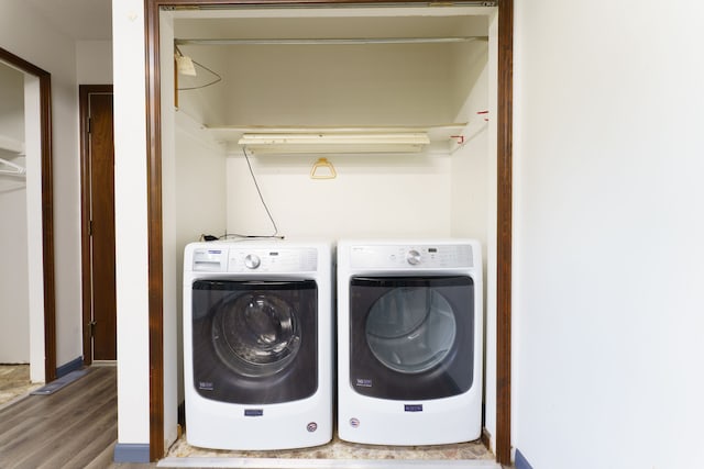 4384 Dexter Pinckney Rd, Dexter, MI 48130 - laundry area featuring washing machine and dryer and wood finished floors