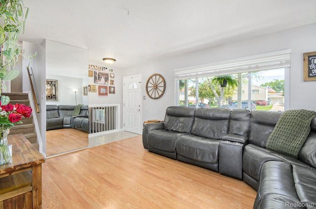 2426 Camel Dr, Sterling Heights, MI 48310 - living room with light wood finished floors and stairs