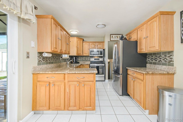 2426 Camel Dr, Sterling Heights, MI 48310 - kitchen with appliances with stainless steel finishes, tasteful backsplash, light tile patterned floors, and a sink