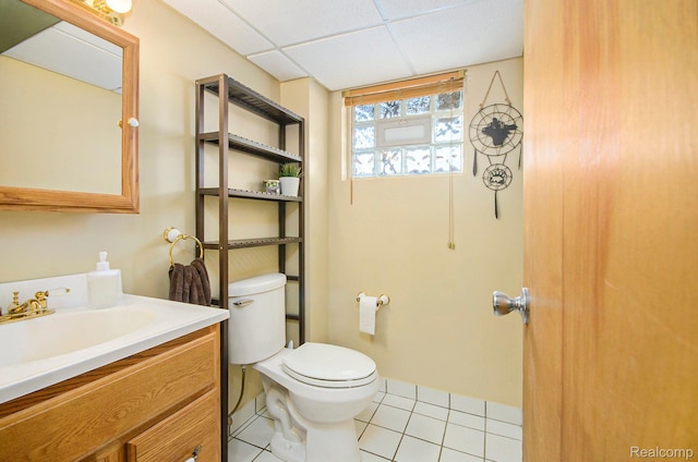 2426 Camel Dr, Sterling Heights, MI 48310 - bathroom with toilet, vanity, tile patterned flooring, and a paneled ceiling