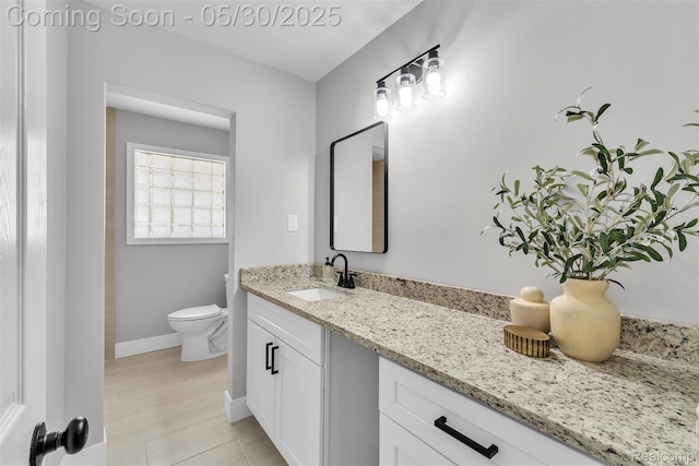 22929 Wrexford Dr, Southfield, MI 48033 - bathroom featuring vanity, toilet, and baseboards