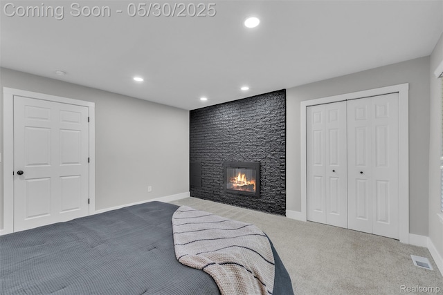 22929 Wrexford Dr, Southfield, MI 48033 - carpeted bedroom featuring a fireplace, recessed lighting, baseboards, and a closet