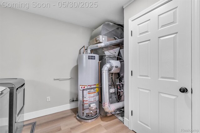 22929 Wrexford Dr, Southfield, MI 48033 - utility room with water heater and independent washer and dryer