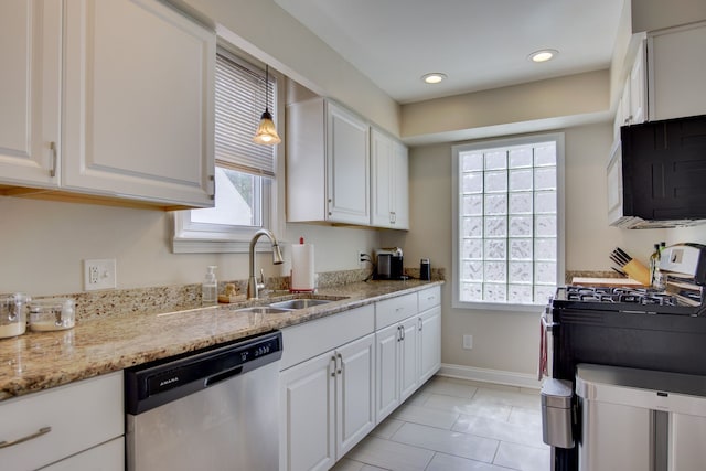 kitchen with stainless steel appliances, a sink, white cabinetry, and recessed lighting