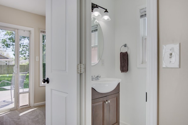 bathroom with vanity and baseboards