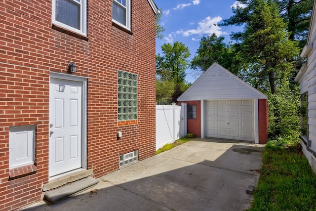 detached garage featuring driveway