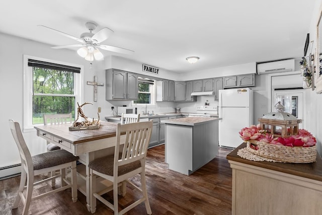 19354 Bueche Rd, New Lothrop, MI 48460 - kitchen featuring gray cabinets, white appliances, a wall mounted AC, and a sink