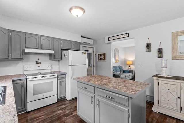 19354 Bueche Rd, New Lothrop, MI 48460 - kitchen with white appliances, gray cabinets, and under cabinet range hood