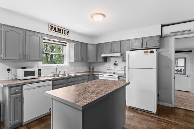 19354 Bueche Rd, New Lothrop, MI 48460 - kitchen with white appliances, gray cabinetry, and a sink