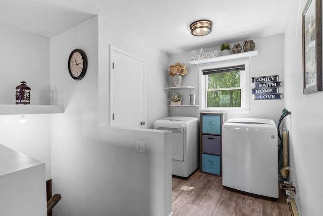 19354 Bueche Rd, New Lothrop, MI 48460 - washroom featuring washer and dryer and wood finished floors