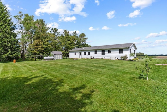 19354 Bueche Rd, New Lothrop, MI 48460 - rear view of property with a yard