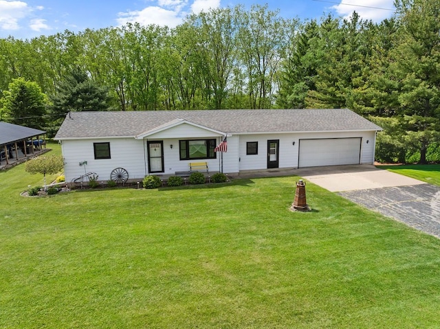 19354 Bueche Rd, New Lothrop, MI 48460 - ranch-style house with concrete driveway, a garage, and a front yard