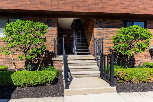 38554 Lanse Creuse St, Harrison Township, MI 48045 - property entrance featuring a shingled roof and brick siding