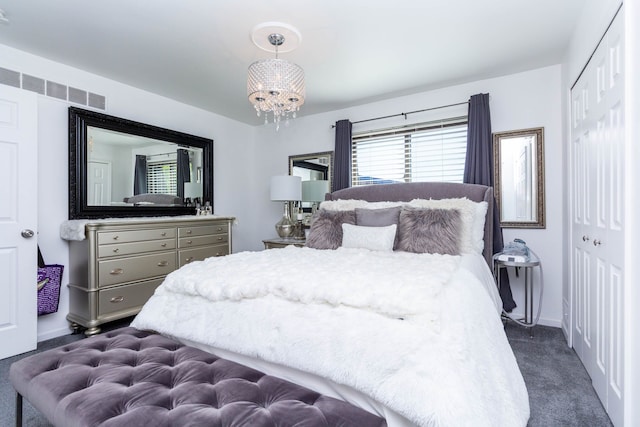 38554 Lanse Creuse St, Harrison Township, MI 48045 - bedroom featuring dark carpet, a closet, a chandelier, and baseboards