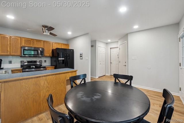 326 Redmaple Ln, Brighton, MI 48116 - kitchen featuring stainless steel appliances, decorative backsplash, light wood-style flooring, baseboards, and recessed lighting