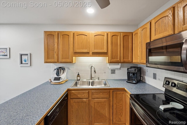 326 Redmaple Ln, Brighton, MI 48116 - kitchen featuring appliances with stainless steel finishes, a sink, backsplash, and brown cabinets