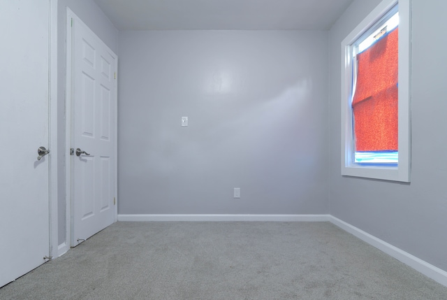 19926 Mendota St, Detroit, MI 48221 - unfurnished bedroom featuring carpet floors, multiple windows, and baseboards
