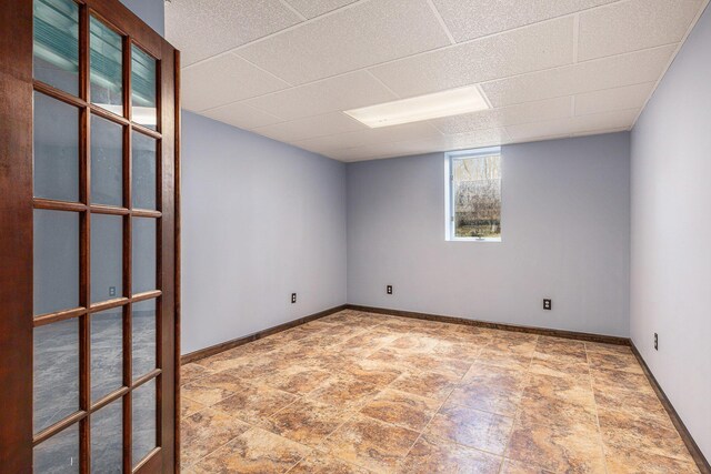 10191 84th St SE, Alto, MI 49302 - empty room featuring baseboards and a drop ceiling