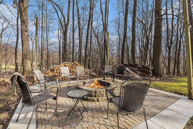 10191 84th St SE, Alto, MI 49302 - view of patio featuring a fire pit