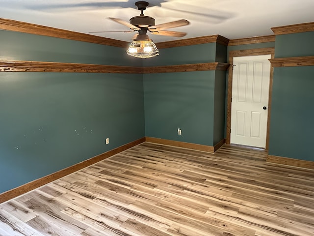 10191 84th St SE, Alto, MI 49302 - spare room featuring ceiling fan, ornamental molding, wood finished floors, and baseboards