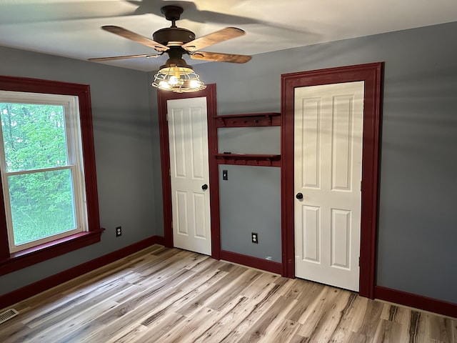 10191 84th St SE, Alto, MI 49302 - empty room featuring light wood finished floors, baseboards, and a ceiling fan