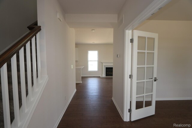 27144 Silo Dr, Saline, MI 48176 - hallway with dark wood-style flooring and baseboards