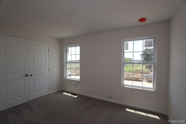 27144 Silo Dr, Saline, MI 48176 - unfurnished bedroom with carpet floors and a closet