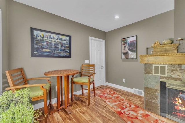 3418 Fieldview Ave, West Bloomfield, MI 48324 - sitting room with wood finished floors, baseboards, recessed lighting, and a tiled fireplace