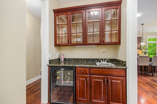 4181 Pavilion Ct, Fenton, MI 48430 - indoor wet bar featuring beverage cooler, dark wood finished floors, and baseboards