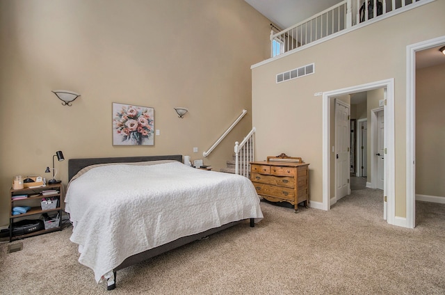 4181 Pavilion Ct, Fenton, MI 48430 - bedroom with carpet flooring, a towering ceiling, and baseboards
