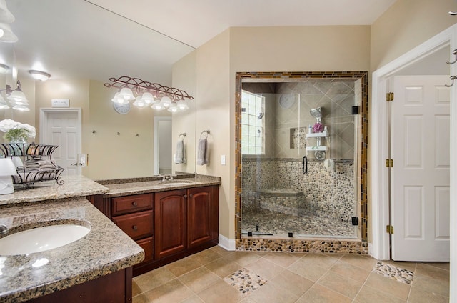 4181 Pavilion Ct, Fenton, MI 48430 - bathroom with a stall shower, tile patterned floors, two vanities, and baseboards