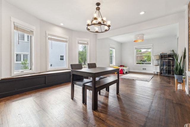 dining area featuring a chandelier, dark wood-style floors, recessed lighting, and baseboards