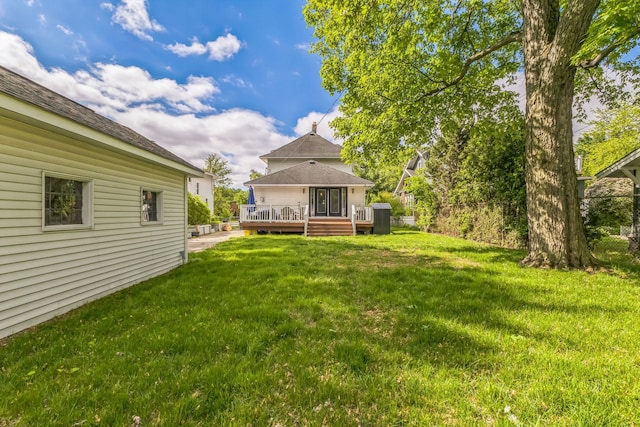 view of yard featuring a wooden deck