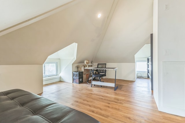 office area featuring vaulted ceiling and light wood finished floors