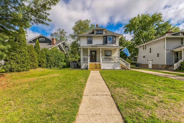 traditional style home featuring a porch, a front lawn, stairs, and a chimney