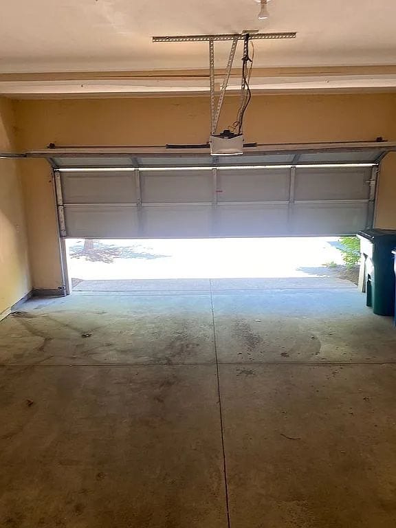 18203 Adri Cir, Walled Lake, MI 48390 - garage with a garage door opener